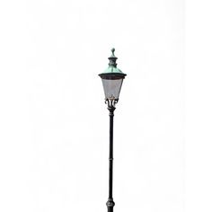 an old fashioned street light with a green top on a white background, in the middle of winter