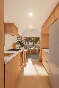 the kitchen is clean and ready to be used as a living room or dining area