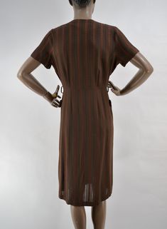 "50's super soft woven dress. Rich brown, with brick red striped pattern. In between stripes are woven alternating stiching to create a checkerboard pattern with negative space, and a little peek-a-boo to the skin. Darling button collar and outside front pockets Slight fading under armpits. In excellent used condition. No belt. 15\" shoulders 12\" sleeve 40\" chest 30\" waist 40\" hips 42\" length" Vintage Brown Midi Dress For Fall, Vintage Brown Midi Length Dress, Retro Brown V-neck Dress, Vintage Brown Knee-length Dress, Retro Brown Dress For Fall, Retro Brown Midi Dress, Classic Brown Dresses For Daywear, Retro Brown Short Sleeve Dress, Retro Brown Dress For Daywear