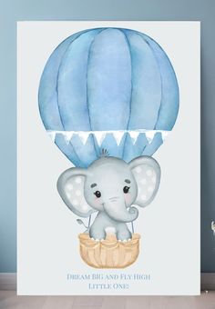 an elephant in a basket with a blue balloon on it's head, and the words dream big and fly high above