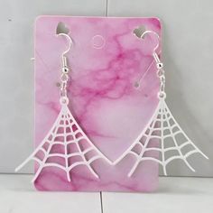 Spider web earrings!- 3d printed earrings! These earrings are designed and printed by me and my family. Made with hypoallergenic 925 plated silver hooks. Super lightweight earrings, weighing in at 0.1 oz Be sure to check out our other earrings! https://erraticandeccentric.etsy.com Hypoallergenic White Jewelry For Halloween, White Laser-cut Jewelry For Gifts, White Laser Cut Earrings As A Gift, Silver Laser Cut Earrings As Gift, White Laser Cut Earrings For Gift, Spider Web Earrings, Web Earrings, 3d Printed Earrings, Printed Earrings