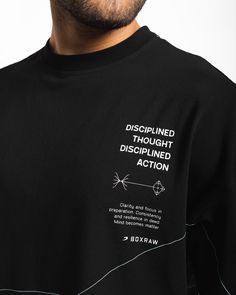 In life, you only have mastery over your thoughts and actions. Through disciplined thought and disciplined action, you begin to foster growth by aligning a focused mindset with purposeful execution. This stretch cotton oversized tee is constructed to provide you with optimal airflow as the rounds build up. Featuring Disciplined Thought, Disciplined Action text and icons, complemented with the golden ratio construction of the Strike Logo, this shirt serves as a reminder to the process we must fol Quotes Shirt Design, Text T Shirt Designs, Tee Shirt Designs Graphics, Tshirt Text Design, T Shirt Ideas Design, Tshirts Design Ideas, Make Up Branding, Black Tshirt Design