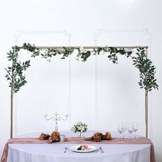 the table is set with flowers and candles