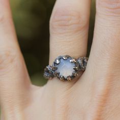 "Tree branch sculpted ring in sterling silver with red garnet gemstone. Witchy style, textured silver ring. This ring was sculpted in wax in the lost wax technique. Details & Measurement: * The ring width on the front side - 0.3\" (10 mm) * The ring width on the back side - 0.15\" (4 mm) * Gemstones in 8 mm to to set in the ring: Blue chalcedony in rose cut, rainbow moonstone, Labradorite, Smoky quarts in rose cut, Rutilated quartz with gold threads. * The ring arrives in a jewelry gift box Unique Silver Sapphire Ring With Rose Cut Diamonds, Ethereal Silver Crystal Ring With Gemstone, Nature-inspired Moonstone Ring, Handmade Ethereal Style Ring, Ethereal Sterling Silver Gemstone Rings, Ethereal Sterling Silver Rings In Silver, Ethereal Sterling Silver Rings, Nature-inspired Sterling Silver Moonstone Promise Ring, Hand Forged Nature-inspired Ring