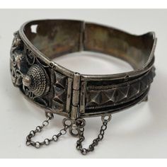 Antique Moorish North Africa Silver Cuff Bracelet. Antique Tunisian, Algeria or Moroccan silver cuff. In good condition, sturdy and high quality design, Maker's mark on outer edge. A well made silver bracelet from North Africa from the French Colonial Times. The Arabic calligraphy is stylized Arabic script. This type of bracelet was produced for European rather than local consumption and were mentioned in the seminal work of Paul Eudel: Dictionnaire des bijoux de l'Afrique du Nord : Maroc, Algérie, Tunisie, Tripolitaine (1906). They were known as "Meqiâsat Tounès" or Tunis bracelets, because they mimic a style of bracelet that was originally made in Tunis after the Turkish Islamic design. Vintage Moorish Etruscan Style Silver Filigree Hinged bangle with Islamic Arabic Calligraphy. A beauti Ornate Oxidized Cuff Bracelet Bangle, Ornate Oxidized Bangle Cuff Bracelet, Antique Silver Engraved Cuff Bracelet, Silver Cuff Jubilee Bracelet, Engraved Antique Silver Cuff Bracelet, Hallmarked Antique Silver Cuff Bangle Bracelet, Ceremonial Silver Metal Cuff Bracelet, Silver Metal Cuff Bracelet For Ceremonial Occasions, Heavy Silver Bracelets For Ceremonial Occasions