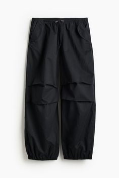 Loose-fit pants in woven fabric. Regular waist  covered elastic at waistband  mock fly  and a drawstring with cord stoppers. Side pockets with flap  mock back pockets with flap  and pleats at sides of knees for added volume. Covered elastic at hems. Baggy Tapered Leg Pants With Drawstring, Sporty Ankle-length Cargo Pants With Elastic Waistband, Relaxed Fit Wide-leg Parachute Pants With Elastic Waistband, Relaxed Fit Wide-leg Cargo Pants With Elastic Waistband, Baggy Cargo Trousers With Elastic Waistband, Baggy Cargo Pants With Elastic Waistband, Solid Streetwear Pants With Elastic Waistband, Solid Color Streetwear Pants With Elastic Waistband, Streetwear Pants With Elastic Waistband