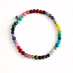 Our happy Rainbow bracelet is bright and projects a feeling of happiness - made with a mix of gemstones such as: Malachite, Firestone, Turquoise, Coral, Jade, onyx, Amethyt, Rose Quartz, Tigereye, Garnet, Lapis etc. 14k solid gold beads are strung between the gemstones  Details: ✦ 14k solid gold Beads ✦ Stretch elastic ✦ 4mm gemstone beads ✦ 4mm solid gold beads  ✦ Our 14k gold is hallmared with VFD and 585 ( 14k) stamp ✦ NEW: Also available in Gold fill and Sterling silver ✦ Matching necklace c Multicolor Gemstone Beaded Bracelets As Gift, Rainbow Natural Stones Beaded Bracelet As Gift, Multicolor Natural Stones Stretch Bracelet For Healing, Multicolor Gemstone Spiritual Stretch Bracelet, Spiritual Multicolor Gemstone Beads Stretch Bracelet, Spiritual Multicolor Stretch Bracelet With Natural Stones, Spiritual Multicolor Gemstone Stretch Bracelet, Spiritual Multicolor Round Stretch Bracelet, Adjustable Multicolor Gemstone Stretch Bracelet