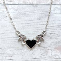 Winged devil heart charm necklace perfect for Halloween jewellery, would look great with any costume. *The necklace measures 14in, 16in, 18in, 20in and 22in. *The heart charm is tibetan silver and with coloured enamel. They measure approximately 6cms. *The heart can come in either black or red, this can be selected from the menu. *The chain and findings are silver plated. ☆☆The necklace comes presented in a gift bag but boxes and gift messages are also available to purchase from my store.☆☆  If you have any questions or custom orders please feel free contact me.