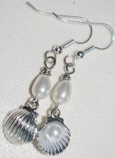 Handmade Earrings: Silver Scallop Shells with Pearls Handmade Silver Shell-shaped Pearl Earrings, Silver Shell-shaped Pearl Earrings For Gifts, Silver Shell-shaped Earrings With Pearl Drop, Wrapping Crystals, Silver Pearl Earrings, Wire Wrapping Crystals, Scallop Shells, Shell Earrings, Ear Jewelry