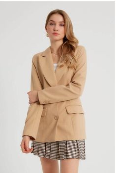 A rockstar blazer meets pure sophistication in this women's designer light camel blazer. This piece has a luxe peak lapel, functional buttoned front and generously padded shoulders that will enhance any outfit. Add this classic piece to your wardrobe revamp for next time you're dressing up for that big promotion at work or heading out on the town Product Features - Pure sophistication written all over it - Comes with luxe peak lapels and functional buttonfront - Padded shoulder adds comfort, sup Trendy Lapel Collar Blazer For Office, Trendy Office Blazer With Lapel Collar, Trendy Double-breasted Office Blazer, Trendy Notch Lapel Blazer For Office, Trendy Formal Blazer With Suit Collar, Trendy Single Button Blazer With Lapel Collar, Trendy Single-button Blazer With Lapel Collar, Trendy Notched Blazer For Formal Occasions, Beige Long Sleeve Blazer For Semi-formal