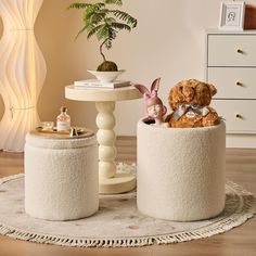 two white stools with stuffed animals on them