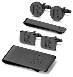 three black cufflinks with the letter r on them