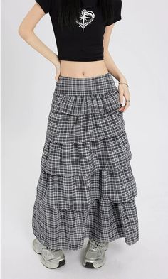 Channel understated chic with this Layered Plaid Maxi Skirt featuring delicate ruffle details.
Crafted from a comfortable blend of mainly cotton, this skirt showcases a multi-layered design that adds a playful twist to the classic plaid pattern. The high-waist cut ensures a flattering silhouette, while the versatile style makes it easy to dress up or down. It's a piece that carries a perfect balance of edgy and professional aesthetics.
Pair this skirt with a tucked-in graphic tee and sneakers fo Chic Cotton Ruffled Mini Skirt, Layered Long Skirt For Spring, Relaxed Cotton Mini Skirt With Ruffles, Cotton Ruffled Mini Skirt With Relaxed Fit, Cotton Tiered Mini Skirt With Lining, Chic Cotton Tiered Mini Skirt, Chic Tiered Maxi Skirt With Layered Hem, Chic Layered Tiered Skirt Bottoms, Chic Tiered Skirt With Layered Hem