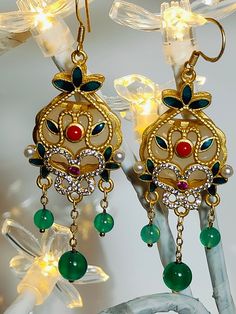 These earrings crafted from green celadon, green agate, and white synthetic stones, intended for your beloved her. Green Jade Earrings For Pierced Ears, Elegant Green Agate Jewelry, Bohemian Green Jeweled Jewelry, Elegant Green Chandelier Earrings For Festive Occasions, Vintage Green Jeweled Earrings, Bohemian Gold Jade Earrings, Elegant Jeweled Green Earrings, Green Jade Earrings For May Birthstone, Elegant Green Jeweled Earrings