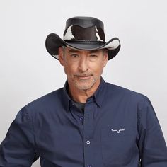 This exquisite Pinto leather cowboy hat offers the perfect combination of western and urban style. Its classic western outback brim, hair on calf mid crown, and brown three-braided band with a brown leather tab make for a sophisticated and timeless design. Whether you're looking to complete a cosmopolitan look or embrace your inner cowboy, this classic piece will always be en vogue. Featuring a super comfortable removable sweatband liner that attaches securely with velcro tabs sewn-in to the hat Western Leather Fedora With Flat Brim, Western Style Leather Fedora With Flat Brim, Country Style Leather Hat Bands For Rodeo, Wide Brim Leather Fedora For Western-themed Events, Leather Wide Brim Fedora For Western-themed Events, Fitted Leather Country Hat, Western Leather Hat Bands For Country Events, Leather Western Hat Bands For Country Events, Leather Fedora With Short Brim For Western-themed Events