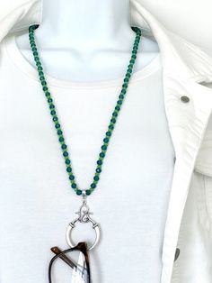 Prevent losing your expensive sunglasses and that annoying glasses hunt. This beautiful glasses ring chain looks wonderful as a necklace as well!    My handcrafted cheerful Spring green and sparkling blue beaded eyeglass chain holds your glasses vertically in a swirl design matte silverplated pendant which will fit almost all glasses.  Just insert the sidepiece of your glasses in the loop and fold.  Enjoy an updated way to hold your sunglasses or reading glasses!   I used pretty green opaque faceted glass beads (approx 4x3mm)  and 5mm faceted aqua crystal glass beads to make this subtly sparkling and useful eyeglass lanyard.  There is a silver plated toggle clasp in the back that compliments the swirls in the pendant. It measures about 27 inches around your neck and slips over your head. T Expensive Sunglasses, Eyeglass Holder Necklace, Beaded Eyeglass Chain, Beaded Glasses, Beautiful Glasses, Glasses Holder, Chain Loop, Ring Chain, Eyeglass Chain