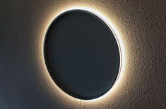 a circular light that is on the wall