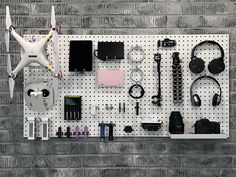 High density fiberboard is a cost effective and decorative pegboard storage and organization solution for garage, warehouse, and tool storage area. Hanging this sturdy pegboard on a wall maximizes usable storage space on walls for easy organization and accessibility. Use Triton DuraHook 70000 series locking pegboard hooks along with the high density fiberboard pegboards to solve any storage challenges. Unlike many pegboards that are constructed with layers of glued cardboard, these boards are wood construction and will not dry out and fray. Clean up the clutter and use these pegboards to get your tool storage areas organized while also keeping tools readily accessible and available. This set of 2 pegboards includes mounting hardware making this a wall-ready storage option. Triton Products Black Pegboard, White Pegboard, Pegboard Bins, Garage Warehouse, Garage Hooks, Pegboard Storage, Pegboard Organization, Pegboard Accessories, Organization Solutions