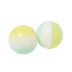 two balls with different colors on them sitting next to each other