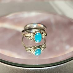 This beautiful vintage Sterling Silver ring features a small, light blue turquoise stone that adds a subtle yet charming touch of color. The soft hue of the turquoise complements the detailed Sterling Silver band, creating a delicate and timeless design that can be worn every day or for special occasions. With its simple elegance, this Size 7 ring is perfect for those who appreciate vintage Southwestern style or love understated pieces with a natural flair. Its fine craftsmanship and natural patina make it a lovely addition to any jewelry collection. Details: Metal: Sterling Silver (.925) Gemstone: Small Light Blue Turquoise Ring Size: 7 Patina: Natural vintage patina Style: Southwestern, Minimalist, Vintage This ring is a wonderful gift for turquoise lovers or those who appreciate vintage Patina Style, Minimalist Vintage, Vintage Sterling Silver Rings, Southwestern Style, Small Light, Sterling Silver Bands, Simple Elegance, Blue Turquoise, Turquoise Stone