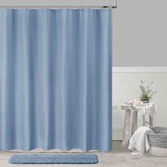 a blue shower curtain in a bathroom