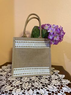 Burlap jute tote bag with handles. Laminated interior. 12X12X7.8inch.Sturdy, waterproof. Beige Rectangular Canvas Bag With Reinforced Handles, Beige Burlap Shopping Bag, Beige Burlap Tote Bag, Beige Burlap Rectangular Beach Bag, Rectangular Beige Burlap Beach Bag, Cream Rectangular Jute Bag, Rectangular Cream Jute Bag, Rectangular Cream Jute Bags, Beige Burlap Gift Bag