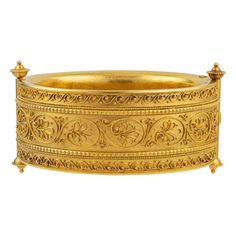 A wide archaeological revival gold bangle, with Etruscan-style wirework decoration to front and back with hidden clasp, Austro-Hungarian hallmark for Prague, 580 gold with unknown maker’s mark W.P., circa 1870, internal diameter approximately 6.6cm, gross weight 99.6 grams. An impressive archaeological revival gold bangle, made in the late nineteenth-century. This bangle was made in Prague and incorporates many elements of the archaeological revival movement, which became popular during the nine Etruscan Jewelry, Byzantine Gold, Jewellery Bracelets, Jewelry Photography Styling, Gold Jewelry Simple Necklace, Handmade Gold Jewellery, Gold Link Bracelet, Bangles Indian, Jewellery Shop