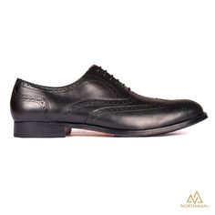 The Vega by Northman+ is a full brogue on the elegant Sleek N+EurX last and a great example of fine Indian shoe-making , handmade from the finest leather by the skilled artisans at Northman+ . Although some see brogues as weekend shoes, these black brogues can actually add a lighter more summery note to grey suiting / office wears. What you see is 100% Handmade Product, did we mention about that comfortable Insole we provide in these shoes? You can stand all day at your work and your feet will t Office Wears, Black Brogues, Indian Shoes, Shoe Making, Best Shoes, Men's Leather Jacket, Classic Elegant, Leather Jackets Women, Office Wear