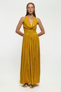 DESCRIPTION The Cowl Neck Maxi dress has a Grecian-inspired silhouette that makes such an elegant choice for any special event. It's made from the softest rayon that artfully gathers around the neck for a hit of drama. The back is elasticised for all-night comfort, and pockets either side bring functionality to form. * Prints and colours may vary slightly due to the handmade nature of each piece. Color: Citrus Chaos DETAILS & CARE INSTRUCTIONS 100% Sustainable Rayon Gentle cold hand wash separat Silk Maxi Dress With Pleated Back For Cocktail, Pre-draped Pleated Silk Dress, Flowy Pre-draped Party Dress, Chic Formal Dress With Gathered Neckline, Flowy Maxi Dress With Ruched Back For Party, Pleated Silk Gala Dresses, Fitted Draped Dress With Gathered Neckline, Pleated Silk Dress For Gala, Silk Maxi Dress With Pleated Back And Fitted Bodice