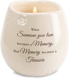 a white ceramic candle holder with the words, when someone you love becomes memory that memory becomes