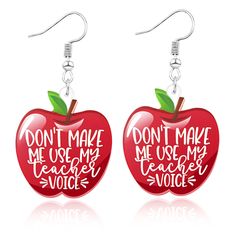 pair of red apple earrings with don't make me use my teacher voice written on them