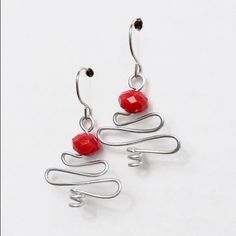 Red Faceted Glass Beads Accent These Artistic Trees Crafted From Swooping Anodized Aluminum Wire. A Delicate And Festive Accessory. Unpierced/Screwback Available. Handcrafted By Me. Bundle For Discounts. Offers Welcome! Holiday Red Ear Wire Earrings, Red Holiday Earrings With Ear Wire, Red Ear Wire Jewelry For Holidays, Red Ear Wire Earrings For Holiday, Red Wire Wrapped Drop Earrings, Holiday Red Beaded Earrings With Ear Wire, Red Wire Wrapped Metal Earrings, Adjustable Silver Christmas Earrings, Red Wire Wrapped Dangle Earrings