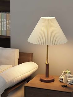 a lamp on a table next to a couch