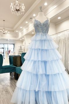 Blue Tiered Dress For Gala, Blue Tiered Tulle Dress, Blue Spaghetti Strap Dress For Debutante Ball, Tiered Tulle Gown For Formal Occasions, Tiered Gown For Prom Season, Formal Tiered Tulle Gown, Blue Tiered Dress For Wedding, Ice Blue Gown, Layers Skirt