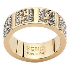 Elevate Your Style With The Iconic F Is Fendi Wide Band Crystal Ring, Featuring Engraved Letters On Gold-Finish Metal. This Classic Ring Includes Engraved Decoration In The F Is Fendi Shape And Decorated With Natural Crystals. Fashion-Forward And Elegant, This Ring Makes The Perfect Finish For Any Outfit. Gift This Gorgeous Ring Or Add It To Your Personal Designer Collection, Only From Fendi. Model: 8ah399 Size: Small (Us Size 5.5) Gold-Finished Metal Ring With Engraved With Ff Logo Decorated Wi Crystals Fashion, Engraved Letters, Fendi Jewelry, Ff Logo, Wide Band Rings, Crystal Ring, Metal Ring, Classic Ring, Wide Bands