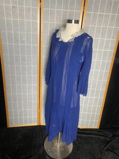 "1930's/40's sheer blue silk long sleeve shirt dress with white ruffle collar. In fair condition - has rips in both underarms, a rip in the right shoulder, and a rip in the collar. Has a side snap closure. I would not recommend wearing this dress unless you reinforce the delicate spots Being sold as is Womens small 38\" bust 42\" max hips 48\" shoulder to hem 16\" back shoulders" Vintage Sheer Blue Dresses, Vintage Blue Sheer Dress, Blue Sheer Vintage Dress, Side Snap, Blue Sheers, Ruffle Collar, Long Sleeve Shirt Dress, Dress Clothes For Women, Long Sleeve Shirt