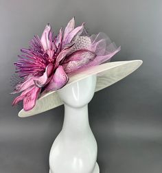 Ivory Oval Hat adorned oversized purple floral bloom. Adorned with netting and the jeweled bee, my signature mark on all of my designer pieces. This piece is adjustable with an internal elastic to fit crown size 22.5" and smaller. Please measure prior to purchasing as all sales are final. Searching for a custom piece? Please contact me via email: TheHatHive@gmail.com for details and pricing. Don't forget to follow us on Instagram @TheHatHive Yellow Fascinator, Fascinator Hats Diy, Ivory Hat, Derby Hats Fascinators, Sinamay Hats, Bridal Hat, Feather Decor, Kentucky Derby Hats, Feather Flower