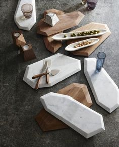 marble and wood serving trays on the ground