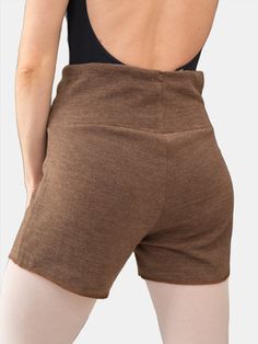 the back of a woman wearing brown shorts