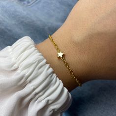 ❥  Minimalist Lucky Star charm bracelet is a cute little guft idea for your Best Friends or if you wish to surprise your Bridesmaids with a dainty little gift ♡ About the bracelet ❥ 2 mm gold  plated chain ❥ 18k plated star charm (4mm) ❥ 0.5 mm gold fadeless copper wire ❥ gold plated lobster clasps closure ❥ 4 cm gold plated extender chain ♡ Size ❥ We offer 3 different sizes: S(15cm) + 4 cm extender chain M(16cm) + 4 cm extender chain L(17cm) + 4cm extender chain ♡ Gift package The bracelets are packed in a white little organza bag ready to be gifted. Please note I need 1-2 working days to prepare your order as all bracelets are carefully handmade. If you have any questions please send me a message I am happy to help you. x Star Charm Bracelet, Bridesmaid Favors, Bracelet Dainty, Hen Do, Gift Package, Star Bracelet, Wish Bracelets, Lucky Star, Gold Star