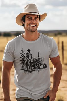 Vintage Farmer, Urban Harvest This t-shirt is a rebellious blend of old-world charm and urban edge. Featuring a bold, street art rendition of a classic 50s farmer, lost in the golden expanse of his cornfield, this design is a fresh take on nostalgia. The juxtaposition of traditional imagery with a contemporary, graffiti-inspired style creates a striking and thought-provoking piece. Wear it to celebrate the roots of our food, or simply as a bold fashion statement. The unisex soft-style t-shirt pu Crew Neck Cotton Shirt For Gardening, Cotton T-shirt With Graphic Print For Gardening, Cotton Graphic Print T-shirt For Gardening, Graphic Tee Crew Neck T-shirt, Zen Clothing, Farm Tees, Farm Tshirt, Farmer Shirt, Classic Garden