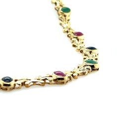 Elevate your jewelry collection with this exquisite vintage 14K yellow gold choker necklace, featuring a captivating cabochon link style. Adorned with vibrant Emerald, Sapphire, and Ruby gemstones with a total of 3 carat weight, this necklace exudes timeless elegance and charm. Each gemstone is carefully selected to create a harmonious blend of colors that will complement any outfit. The 17-inch length of this necklace is perfect for accentuating your neckline, making it a versatile and must-hav Colored Stone, Gold Choker Necklace, Yellow Gold Setting, Gold Choker, Ruby Gemstone, Choker Necklaces, 3 Carat, Gold Set, Diamond Earrings Studs