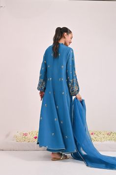 This beautiful three pieces is designed on pure teal blue raw silk in the signature Agha Noor long panelled pishwas silhouette, the balloon sleeves are heavily embellished with hand/ada zardosi work in dabka,naqshi,sequins and stones. Styled with a matching pure organza dupatta and pencil trousers. The length of the lo Pencil Trousers, Agha Noor, Zardosi Work, Organza Dupatta, Balloon Sleeves, The Balloon, Raw Silk, Teal Blue, Balloons