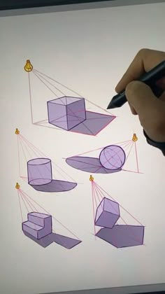 a person is drawing with colored pencils on a whiteboard that has different shapes and sizes