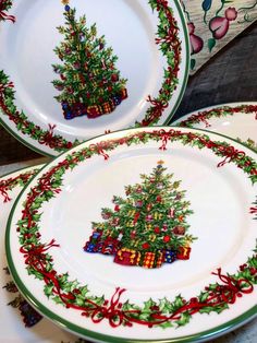 three plates decorated with christmas trees and presents