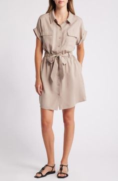 This picture-of-polish shirtdress is designed with chest-flap pockets and a defining tie belt. 36 1/2" length (size Medium) Front button closure Spread collar Short sleeves Chest flap pockets Tie belt Unlined 100% lyocell Machine wash, line dry Imported Spring Collared Shirt Dress With Roll-up Sleeves, Spring Shirt Dress With Collared Neckline And Pockets, Mini Shirt Dress With Pockets For Daywear, Knee-length Shirt Dress With Placket For Summer, Elegant Mini Shirt Dress With Pockets, Spring Mini Belted Dress For Day Out, Summer Workwear Shirt Dress, Mini Length, Button-up Shirt Dress With Tie Waist For Day Out, Chic Workwear Shirt Dress With Roll-up Sleeves