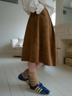 This suede skirt is a versatile piece for the fall and early winter seasons, reimagined from the '24 Spring Volume Cotton Skirt'. It boasts a sturdy and thick suede fabric.- Designed with cut lines at the hem to achieve volume without bulkiness- The silhouette accentuated by dart and cut lines- Can be paired with the Classic Suede Jacket for a coordinated look Suede Skirt Outfit, Skirt Styling, Early Winter, Suede Skirt, Suede Fabric, Style Mistakes, Cotton Skirt, Suede Jacket, Newest Trends