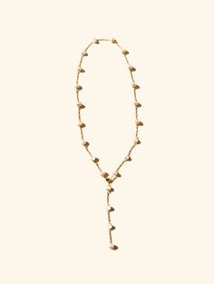 Introducing the Pearl Nugget Lariat – a versatile addition to your jewelry collection. Crafted with elegance and ease in mind, this necklace effortlessly transitions from a classic strand to a Y design, offering endless styling options. made with nugget shaped shell pearls 5 to 6 mm in size and 18 k gold plates chain. Bohemian Lariat Necklace With Pearl Drop, Bohemian Lariat Jewelry With Pearl Drop, Bohemian Lariat Necklace With Pearl Chain, Adjustable Lariat Backdrop Necklace, Elegant Adjustable Long Shell Necklace, Adjustable Lariat Necklace With Pearl Drop, Adjustable Lariat Drop Necklace, Elegant Hand-strung Lariat Necklace, Adjustable Teardrop Lariat Necklace With Delicate Chain