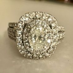 a diamond ring is sitting on a table