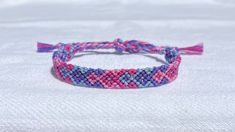 Cheap Casual Purple Friendship Bracelets, Casual Purple Friendship Bracelets, Pink Bohemian Braided Bracelet With Sliding Knot, Bohemian Pink Braided Bracelet With Sliding Knot, Pink Macrame Jewelry For Friendship, Purple Beaded Friendship Bracelet With Sliding Knot, Pink Macrame Bracelets For Friendship, Pink Macrame Braided Bracelet For Friendship, Pink Woven Jewelry For Friendship